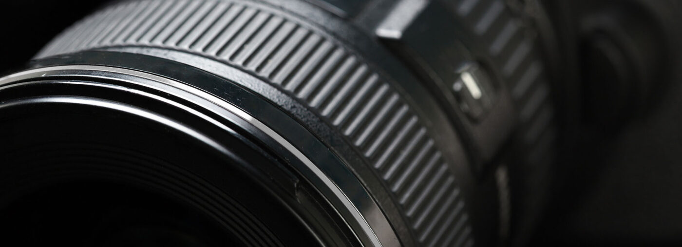 Photography banner with close up of camera lens